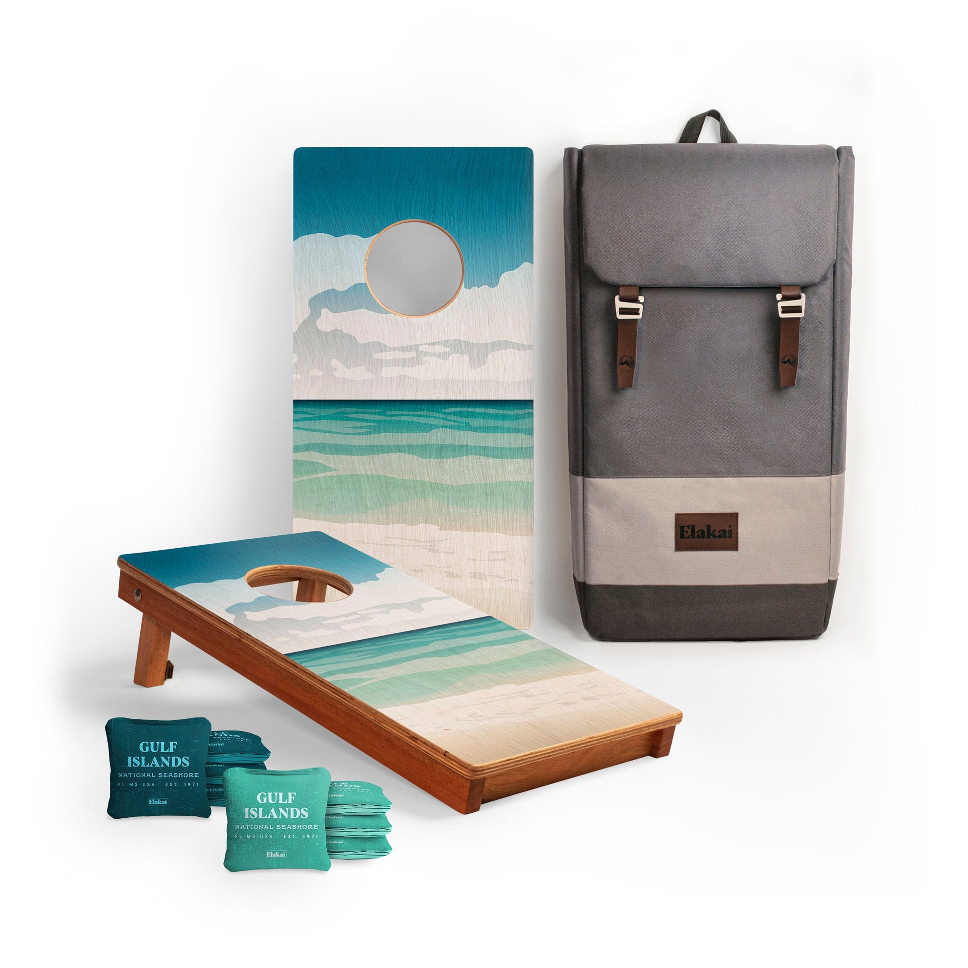 Cornhole board with beach-themed design, backpack, and Gulf Islands cornhole bags