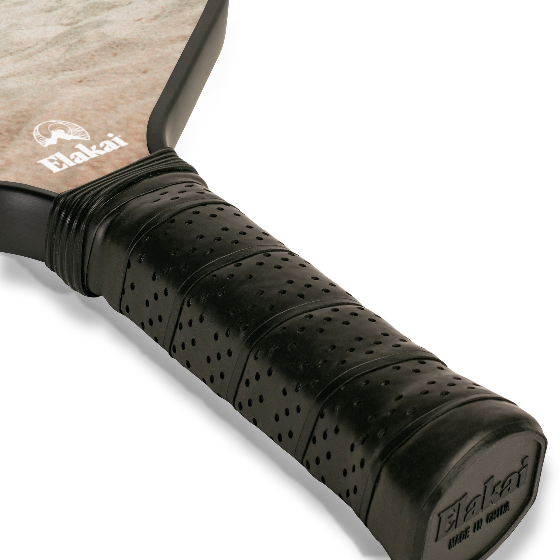 Close-up of a pickleball paddle with black grip and Elakai branding